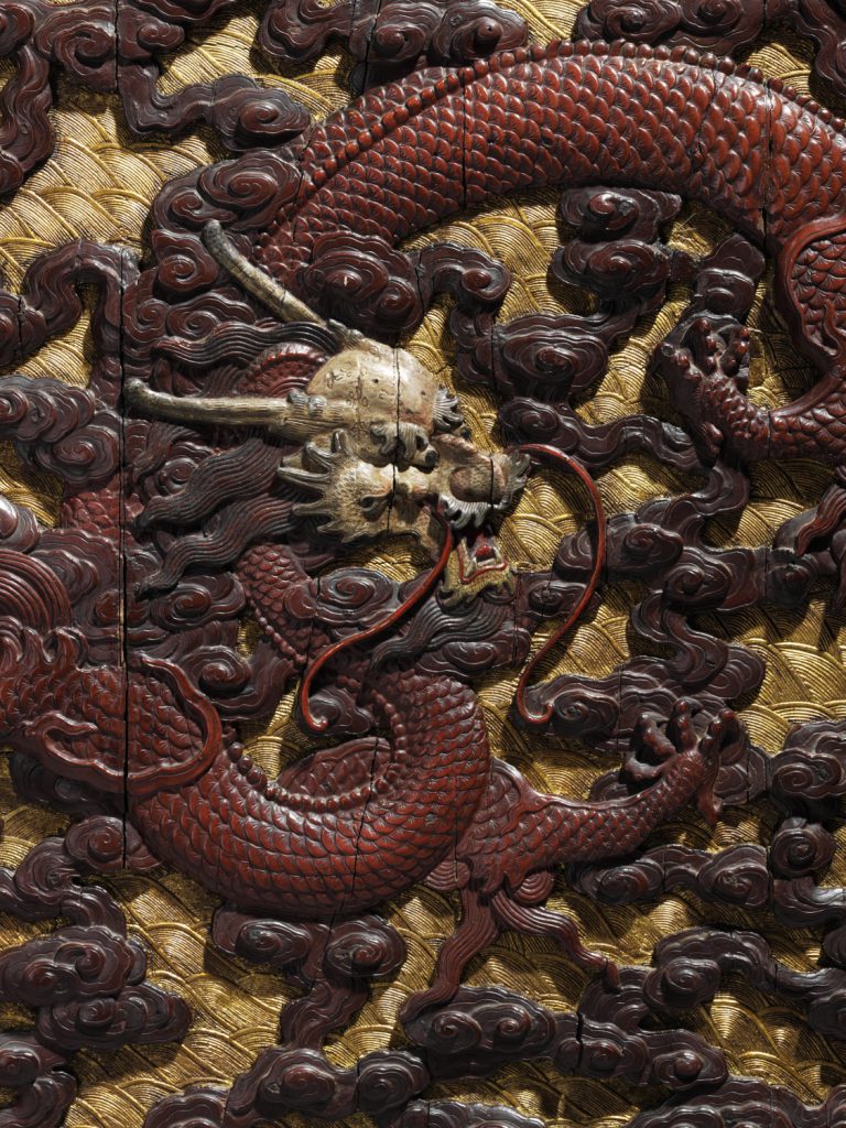 A pair of imperial carved wood, polychrome and gilt-lacquered 'dragon' panels (detail)