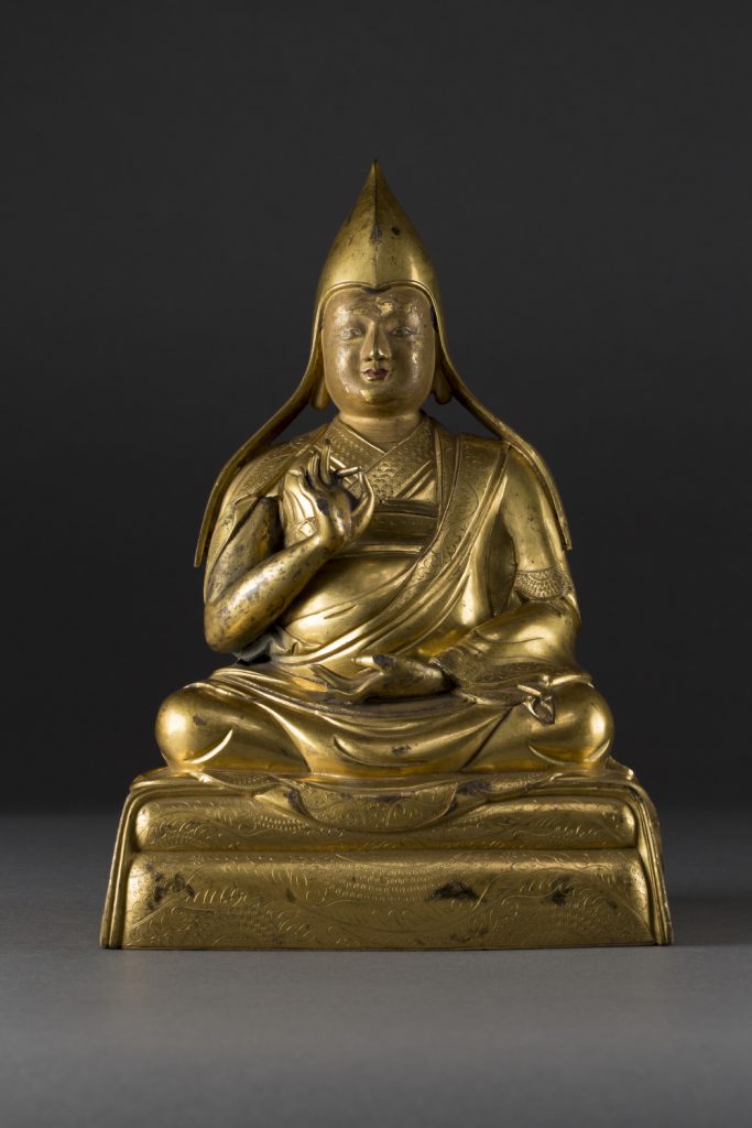 A gilt-bronze figure of Gelugpa Lama