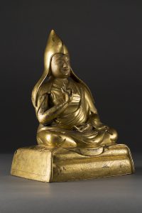 A gilt-bronze figure of Gelugpa Lama