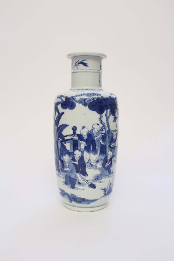 A blue and white boys vase