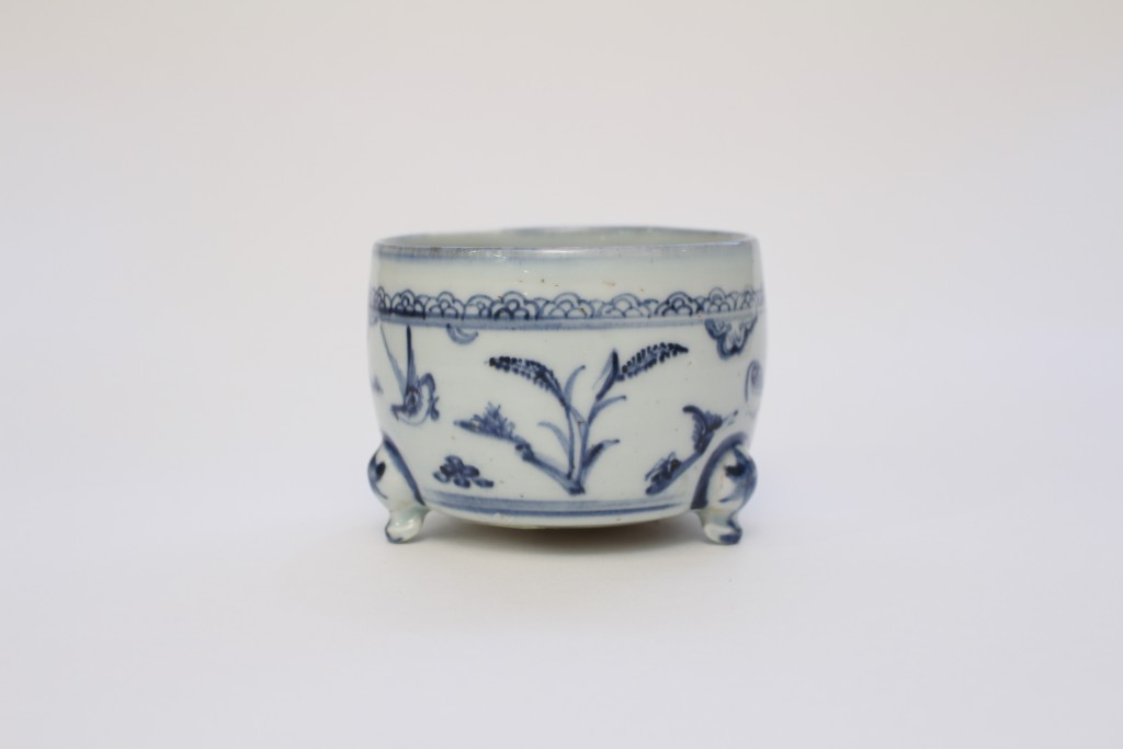 A small blue and white censer
