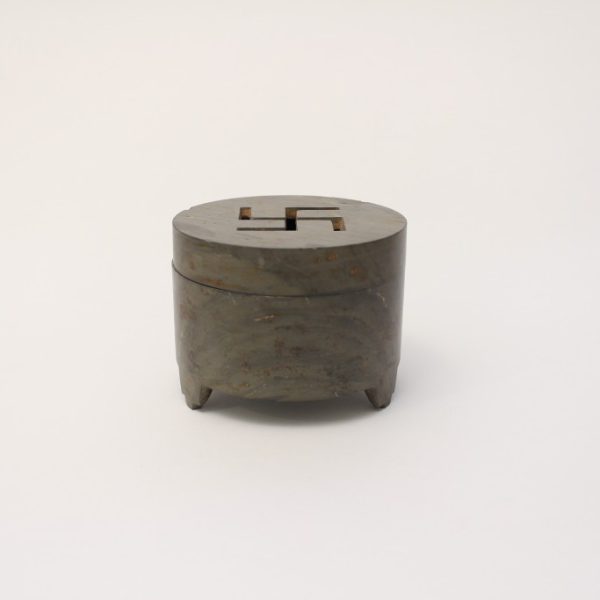 A cylindrical stone tripod censer