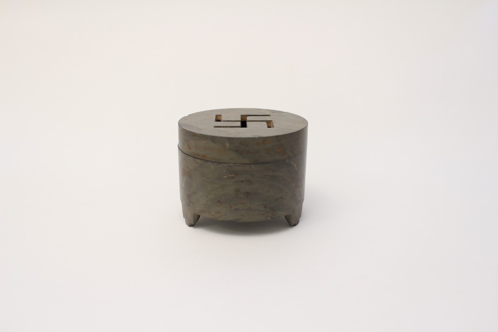 A cylindrical stone tripod censer