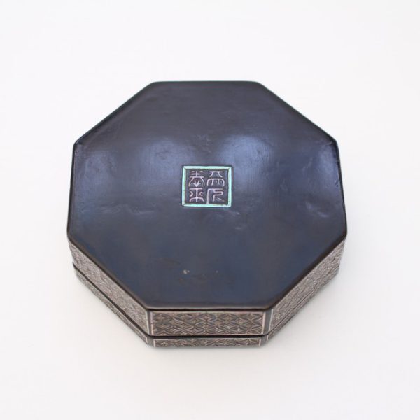 An octagonal mother-of-pearl inlaid box and cover