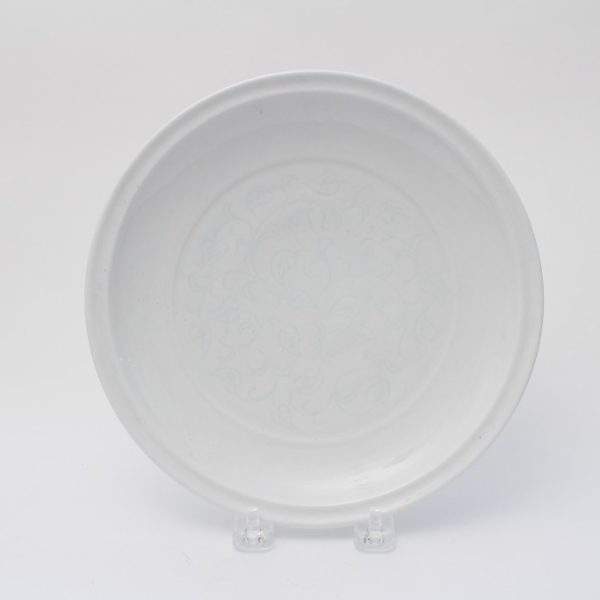 A white-glazed incised dish