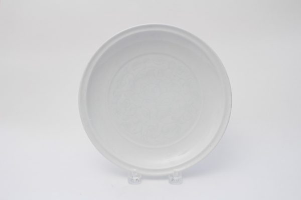 A white-glazed incised dish