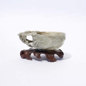 A mottled jade archaistic wine cup
