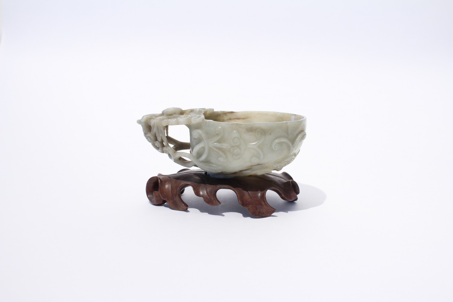A mottled jade archaistic wine cup