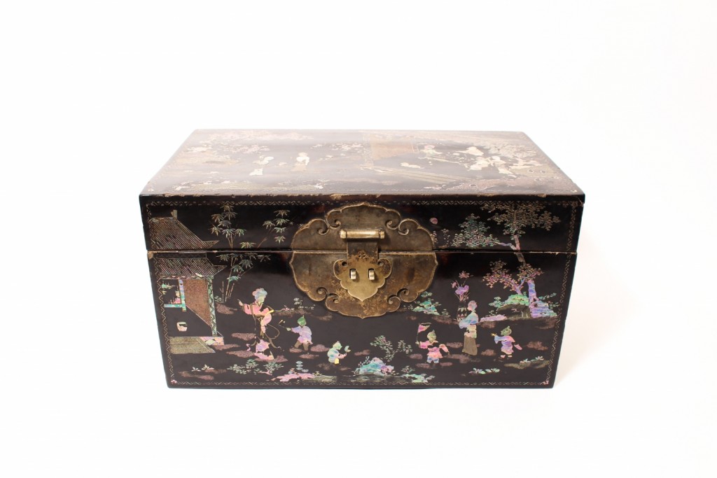 A large mother-of-pearl inlaid black lacquer chest