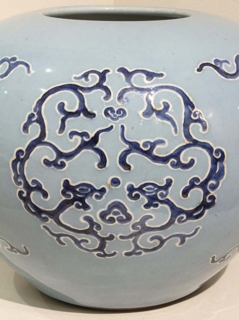 A sky blue jar with cobalt blue and white slip ‘dragon and cloud’ decoration (Qianlong mark and period, 1736-1795)