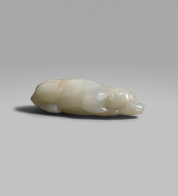 A pale celadon jade carving of a recumbent dog with fitted wood stand (Song/early Yuan dynasty)