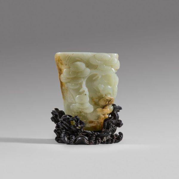 A white and russet jade 'pine' rhyton