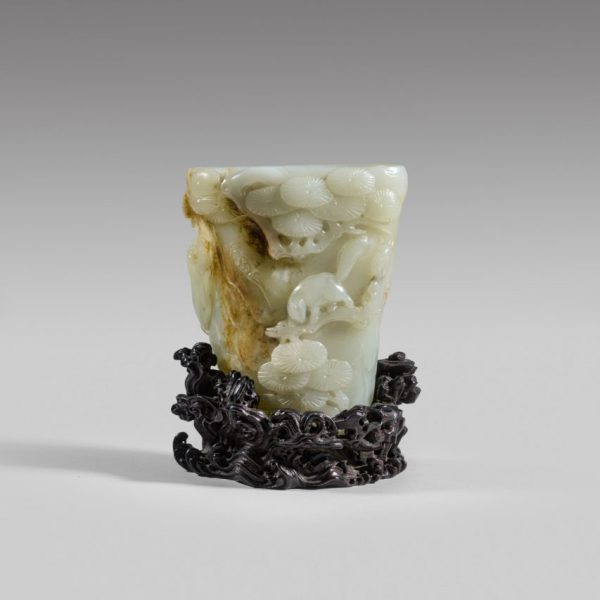 A white and russet jade 'pine' rhyton