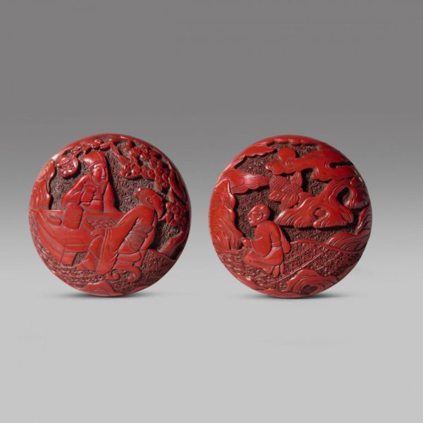 A miniature carved cinnabar lacquer 'figures' box and cover 
