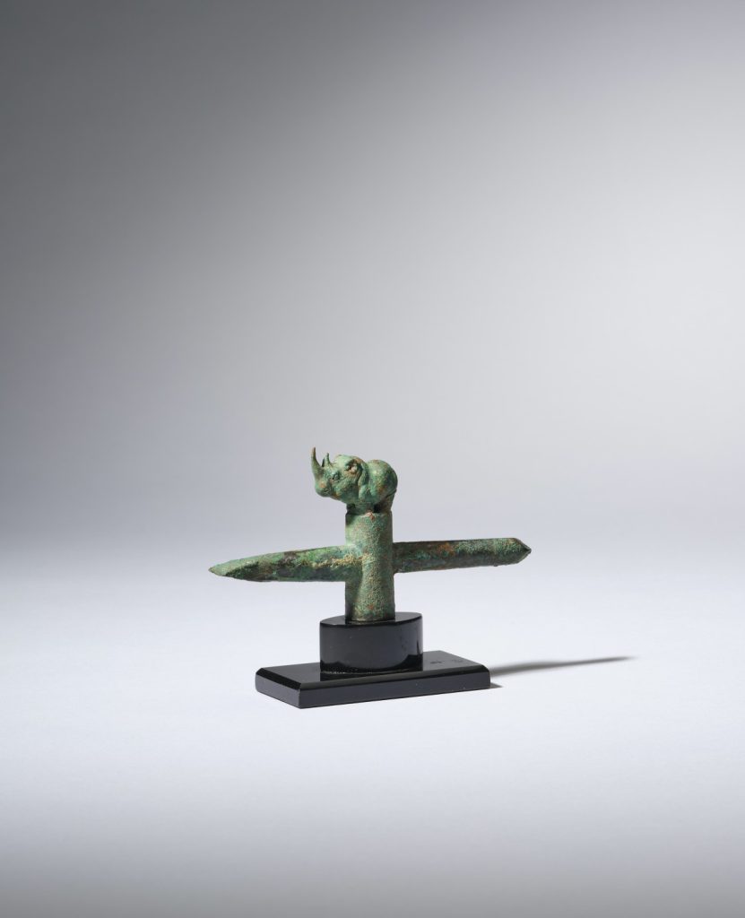 A rare bronze staff finial ‘dingshi’ with a standing rhino (Warring States Period, 4th century B.C.)