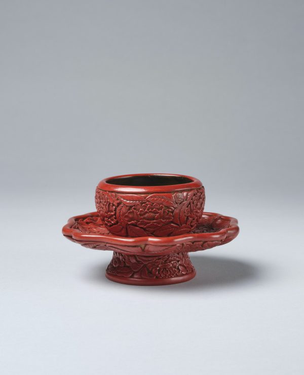 An important carved red lacquer cup stand (Ming dynasty, Yongle mark and period, 1403-1424)
