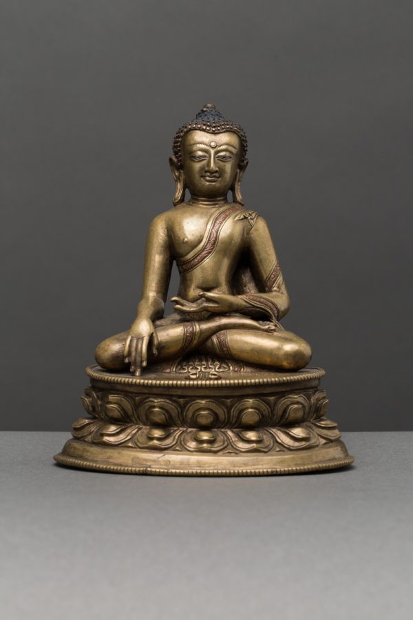 A bronze figure of Buddha Vajrasana with copper and silver inlay