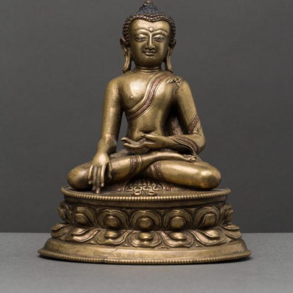 A bronze figure of Buddha Vajrasana with copper and silver inlay
