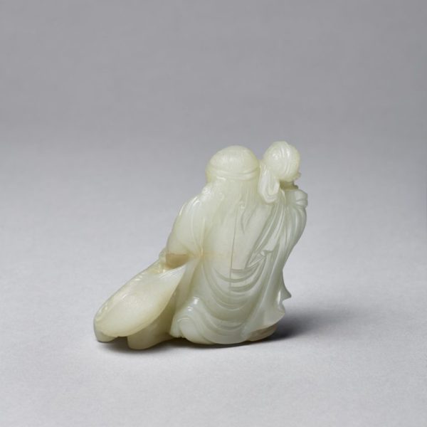 A celadon jade carving of a 'foreigner and lion' group (Late Ming/early Qing 