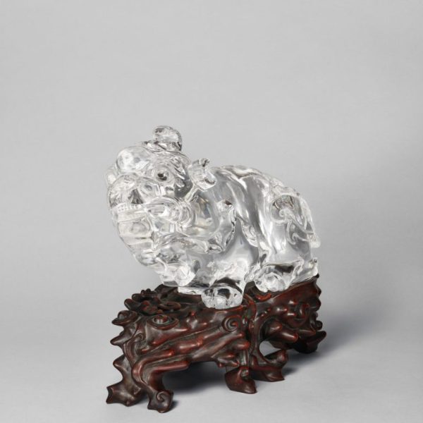 A rock crystal carving of a mythical beast, 'Tianlu', with fitted wood stand (18th century)