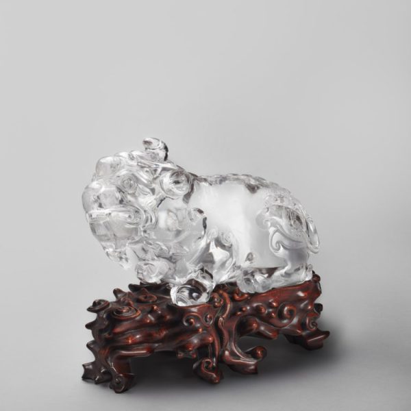 A rock crystal carving of a mythical beast, 'Tianlu', with fitted wood stand (18th century)