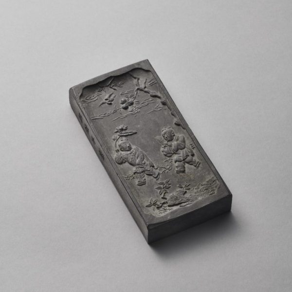 An inscribed ‘Hehe Erxian’ rectangular ink cake (Qianlong carved four-character mark and of the period, 1736-1795)